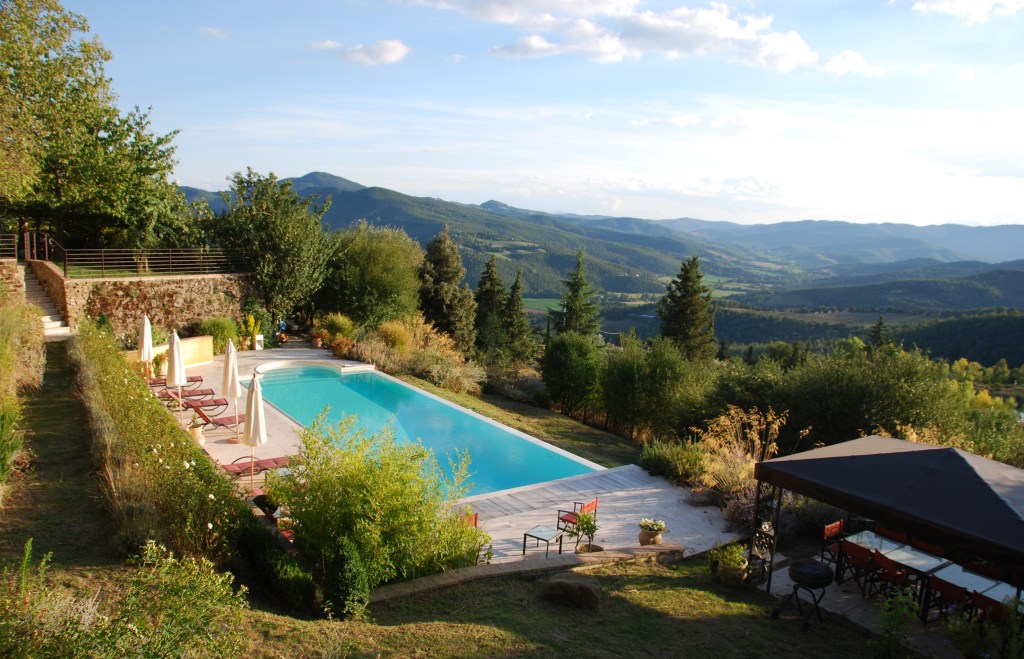 View of pool at Il Casale and mountains in distance